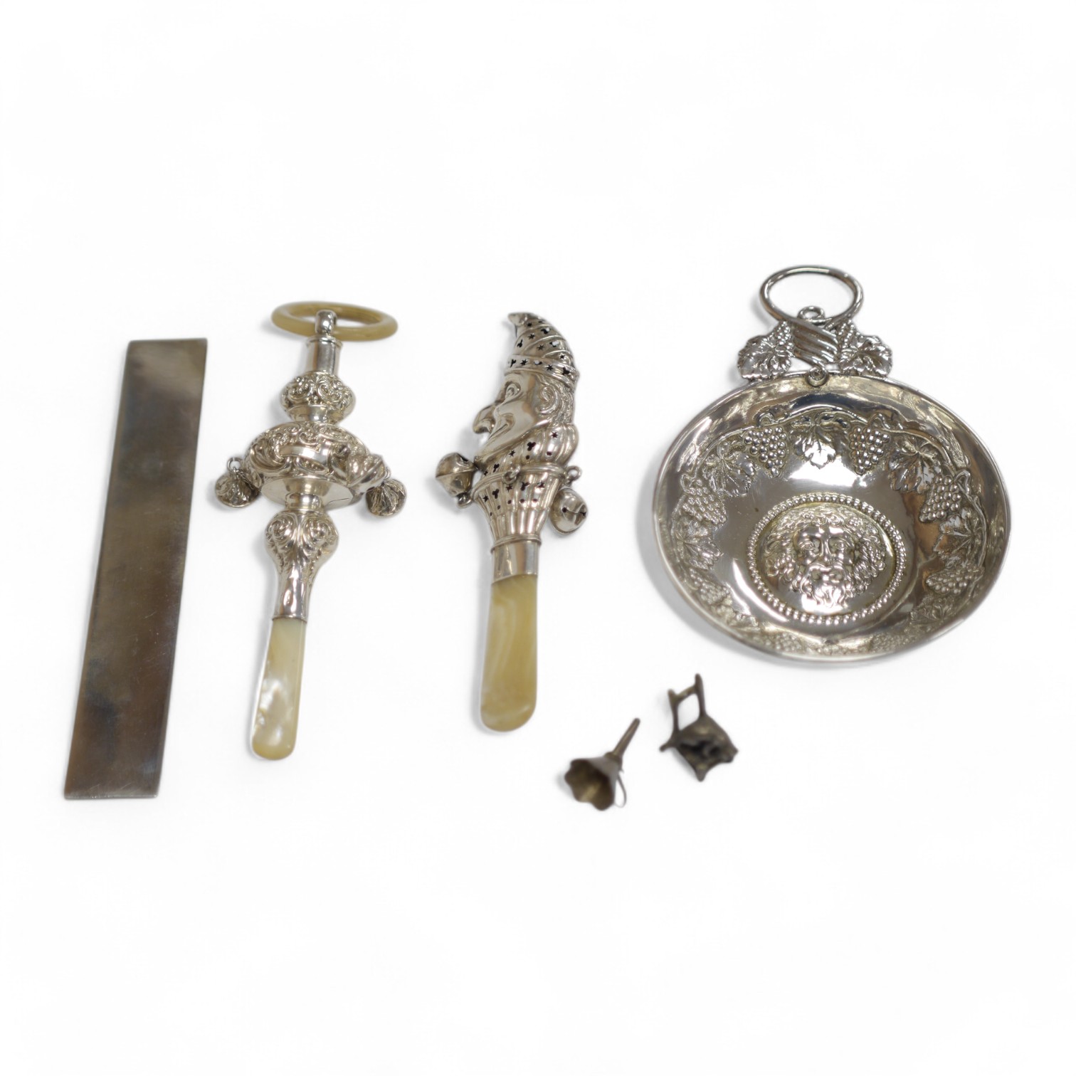 A George V silver and mother of pearl child's rattle, by Crisford & Norris, Birmingham, 1911, 15.2cm, one other sterling Mr. Punch rattle, a George V silver wine taster with fruiting vine decoration, a modern silver 6 in